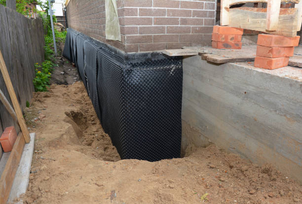 Happy homeowners after waterproofing job in New Germany